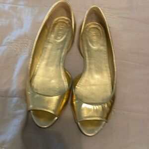 J Crew, gold flats, good condition, shows some wear on the soles